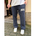 Balenci*ga Distressed Tape Logo Print Trousers