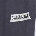 Balenci*ga Distressed Tape Logo Print Trousers