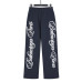 Balenci*ga Cursive Side Logo Embroidered Trousers Balenci*ga Cursive Side Logo Embroidered Trousers