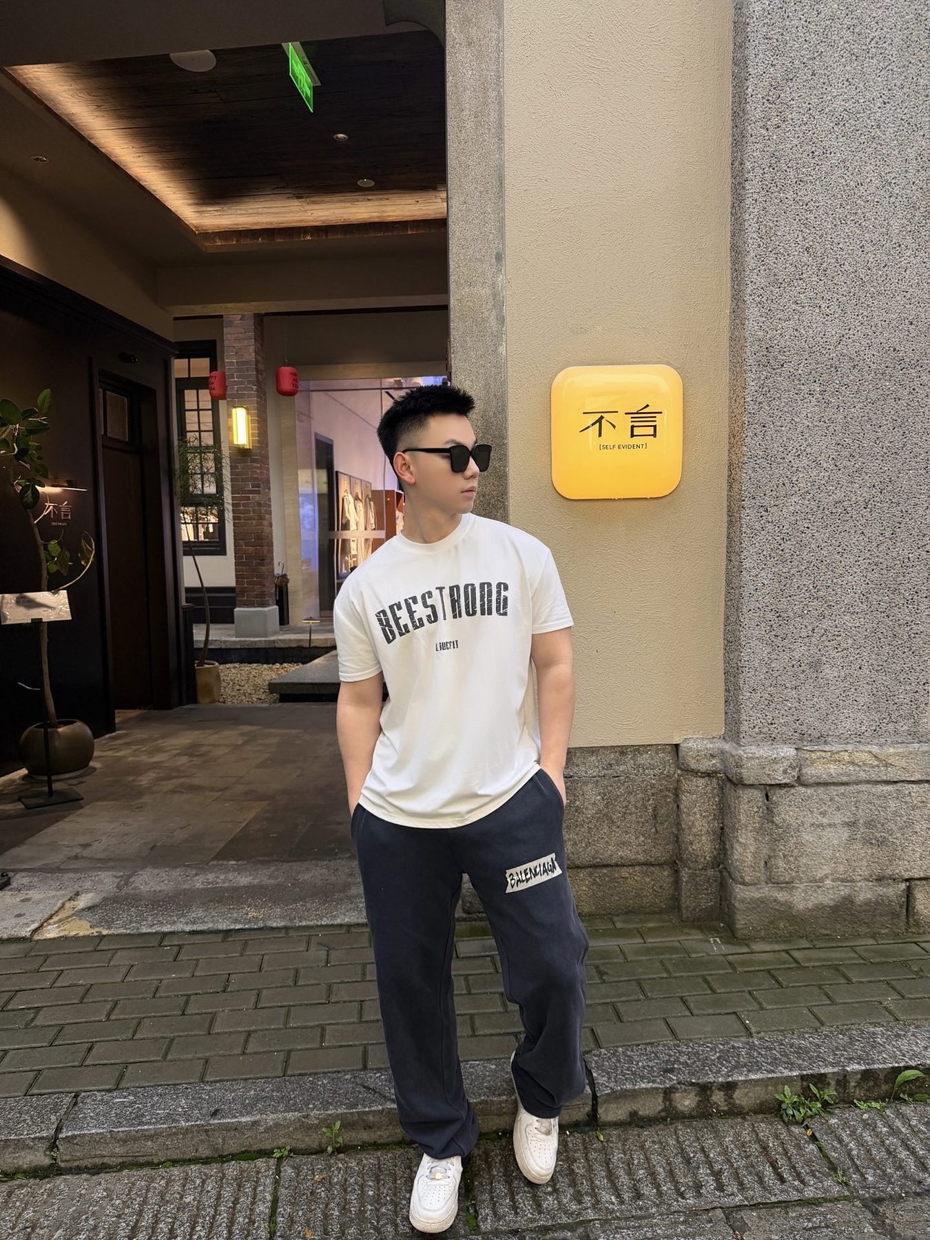 Balenci*ga Distressed Tape Logo Print Trousers