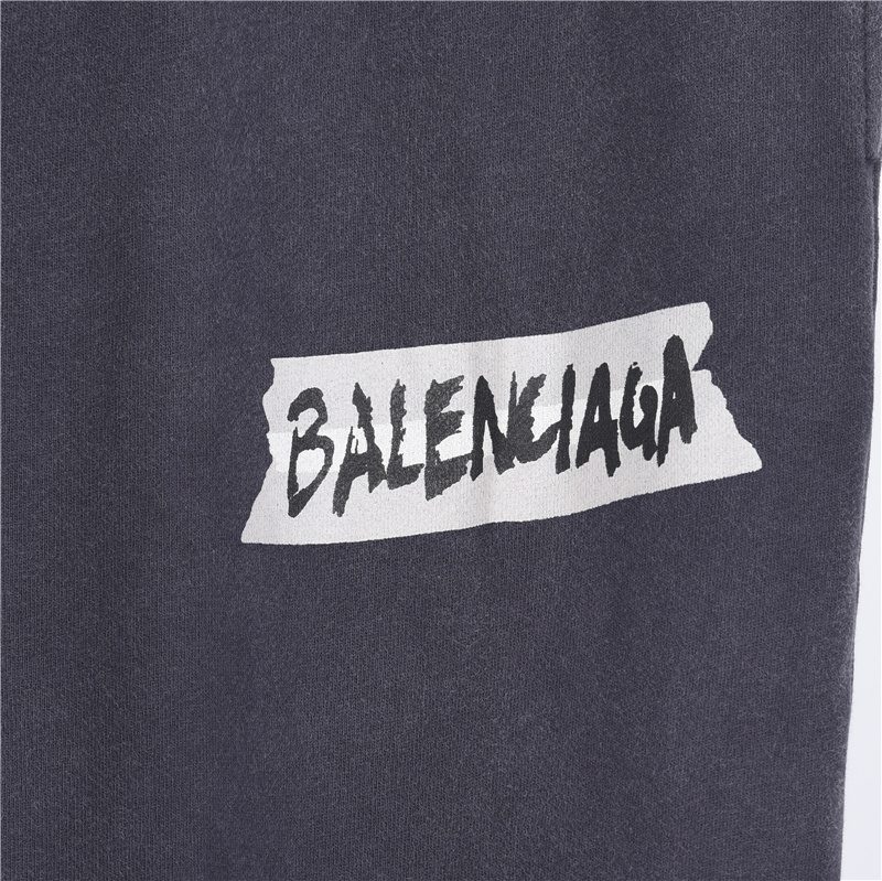 Balenci*ga Distressed Tape Logo Print Trousers