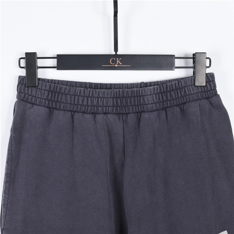 Balenci*ga Distressed Tape Logo Print Trousers